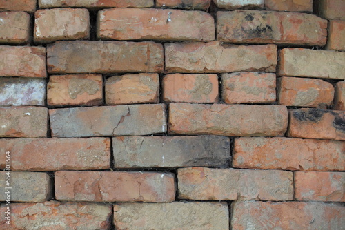 The old used red bricks are laid in an even layer for further operation.