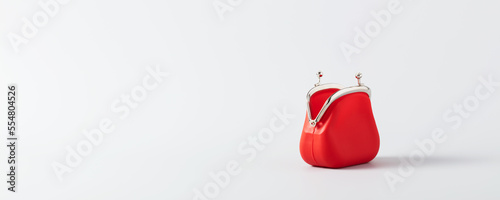 Open Red Coin Purse on blue background with copy space