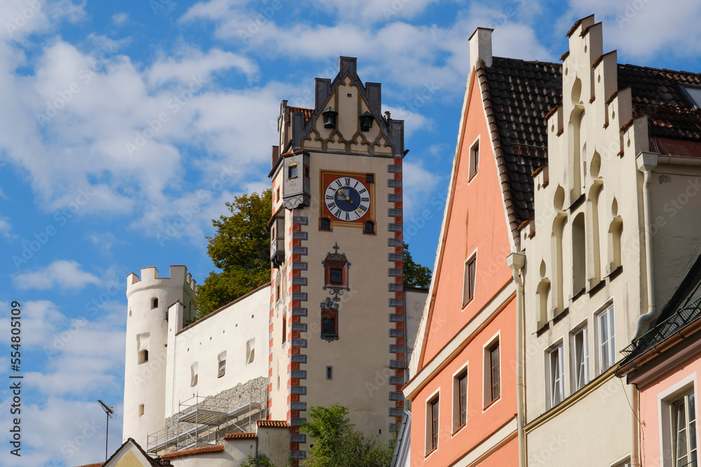 Germany, Bavaria, Fussen, Clock tower ofFussen Castle with housesin foreground Germany, Bavaria, Fussen, Clock tower ofFussen Castle with housesin foreground