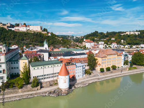 Germany, Bavaria, Passau, Aerial view of Innkai promenade and Schaibling Tower with Veste Oberhaus fort in background photo