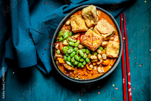 Bowl of ready to eat vegan curry with edamame and tofu photo