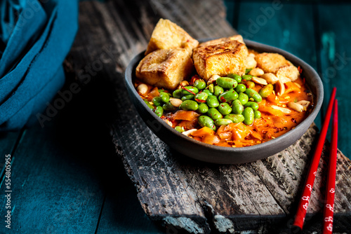 Bowl of ready to eat vegan curry with edamame and tofu photo