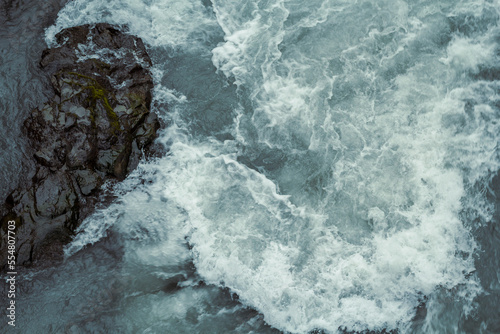 Swirling Hvira river with rock landscape photo. Beautiful nature scenery photography with water flow on background. Idyllic scene. High quality picture for wallpaper, travel blog, magazine, article