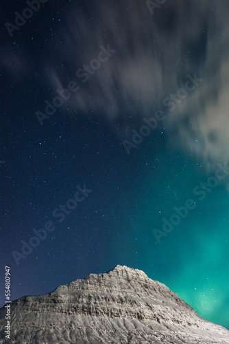 Northern lights over mountain landscape photo. Beautiful nature scenery photography with sky on background. Idyllic scene. High quality picture for wallpaper, travel blog, magazine, article