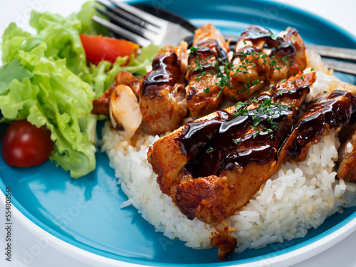Grilled Chicken teriyaki rice on blue plate.