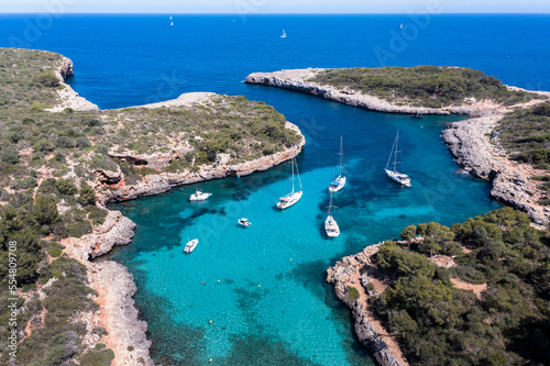 Spain, Balearic Islands, Majorca, Aerial view of Cala Sa Nau bay in summer photo