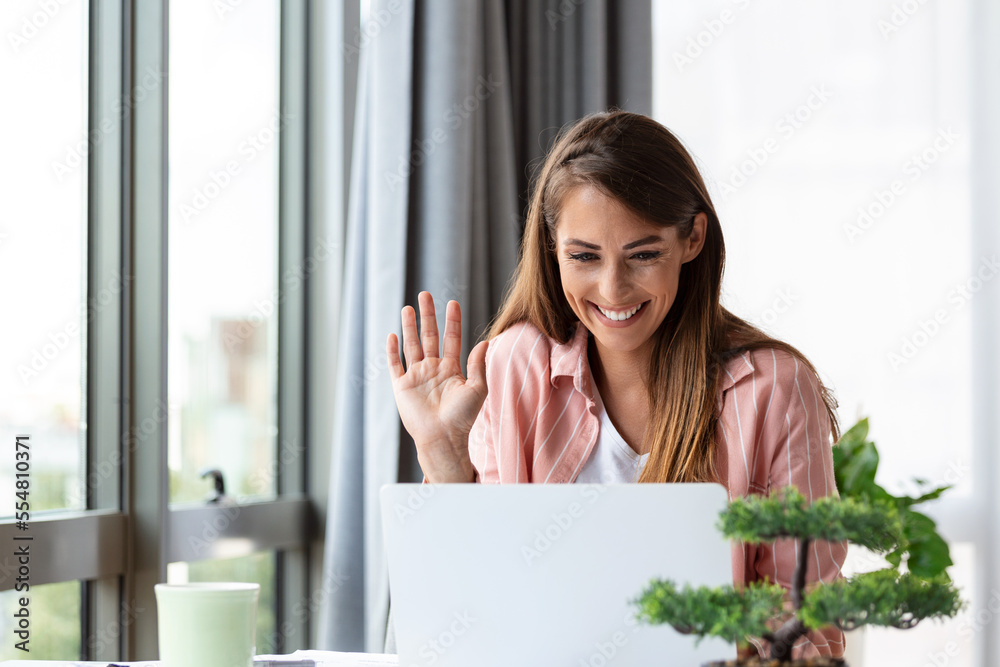 business woman using laptop at home, looking at screen, chatting, reading or writing email, sitting on couch, female student doing homework, working on research project online