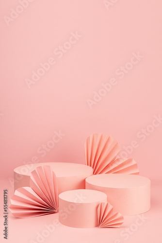 Valentines day soft pastel pink stage mockup with set of three circle podiums  love paper hearts  copy space  vertical. Romance template scene for advertising  presentation cosmetic product  design.