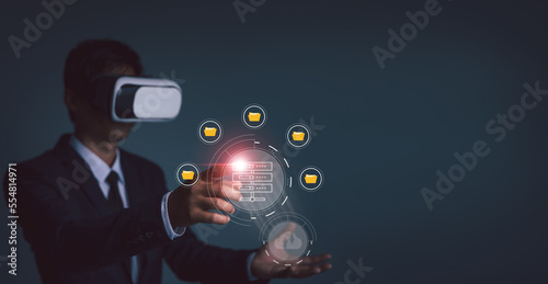 Businessman wearing VR glasses virtual global internet connection metaverse, Document management system, Online document database, process automation to efficiently manage files, future technology