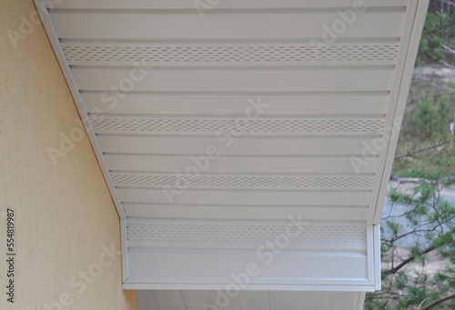  Plastic white uPVC soffit board below the facia of the roof.