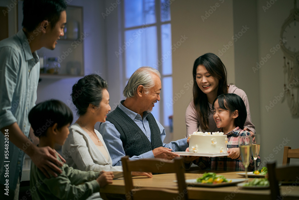 senior asian couple celebrating wedding annversary with three generational family senior asian couple celebrating wedding annversary with three generational family