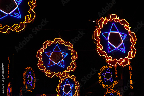 Neon lights shaped into traditional parol, a Filipino ornamental lantern displayed during the Christmas season