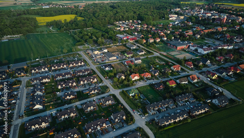 Small european town cityscape, aerial view of residential neighborhood at summer evening