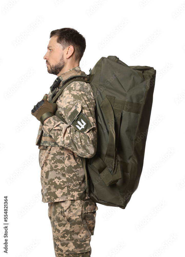 Ukrainian soldier in military uniform with army bag on white background Ukrainian soldier in military uniform with army bag on white background