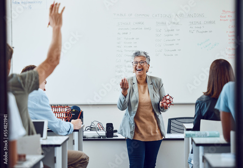 Classroom, teacher and science question at school university or college with dna model in education, learning and teaching. Physics professor with students happy for development or knowledge trust photo