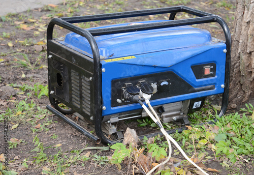 Portable Generator Outdoor. Backup generator as a concept of energy crisis in Ukraine. Backup standby generator.