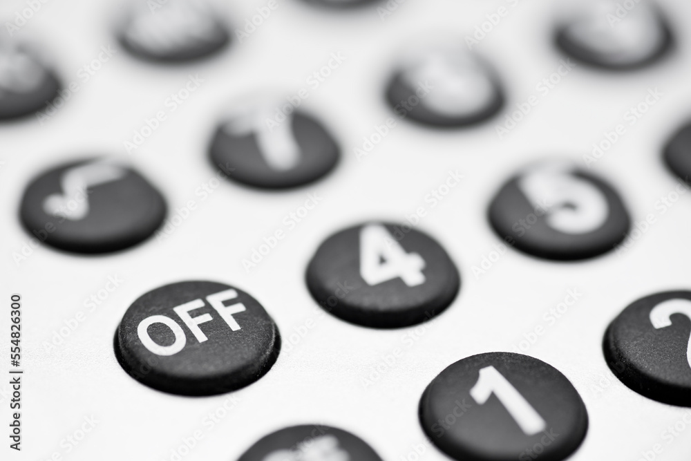 Buttons of a calculator - focus on the OFF button Buttons of a calculator - focus on the OFF button