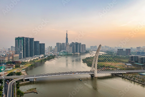 PANORAMA WITH SAI GON RIVER AND BA SON BRIDGE. VIEW FROM DISTRICT 1 TO THU THIEM, HO CHI MINH CITY, VIETNAM photo