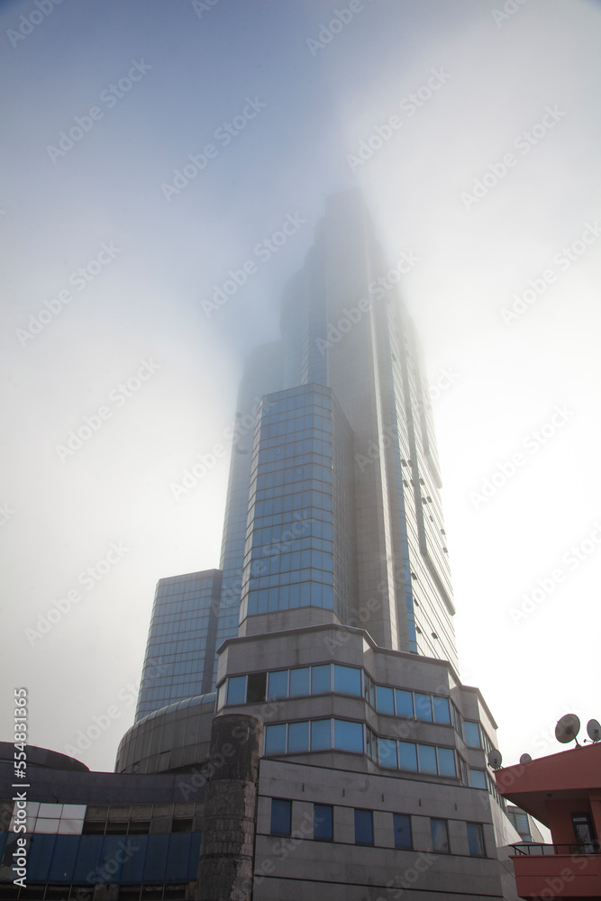 foggy sky in the city center. indoor business centre.  film scene.