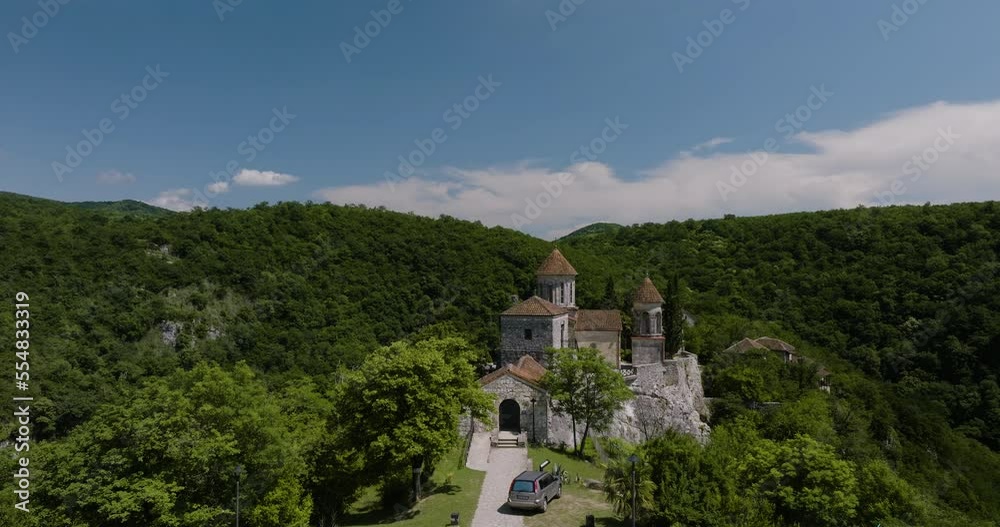 Exterior Of Motsameta Monastery Surrounded By Picturesque Green Canyons In Imereti, Near Kutaisi In Georgia. aerial ascend Exterior Of Motsameta Monastery Surrounded By Picturesque Green Canyons In Imereti, Near Kutaisi In Georgia. aerial ascend