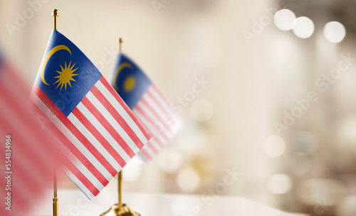Photography Small flags of the Malaysia on an abstract blurry background