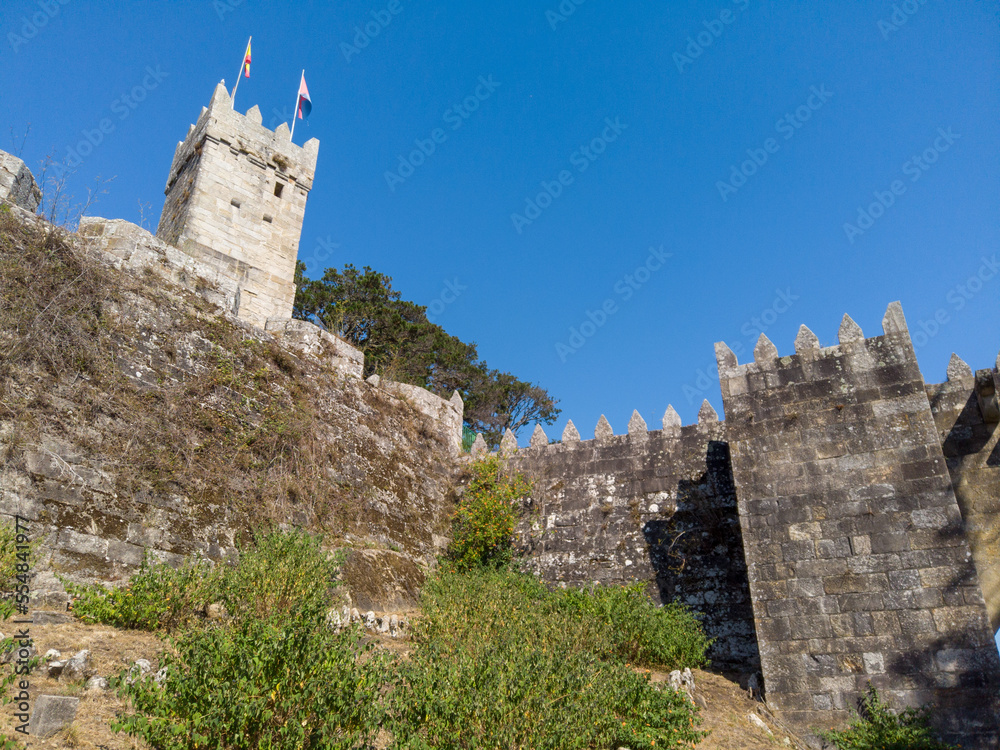 The Fortified Clock Tower next to the Royal Gate of the Historical Castle of Monterreal on the Monte Boi peninsula in the Galician village of Baiona, Spain.