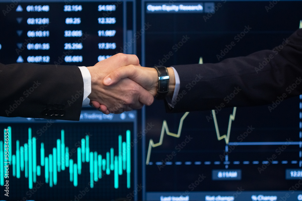 Close-up of male managers hands. Two cheerful men in formalwear shaking hands after good working together and reaching agreement. Business growth strategy and partnership concept Close-up of male managers hands. Two cheerful men in formalwear shaking hands after good working together and reaching agreement. Business growth strategy and partnership concept