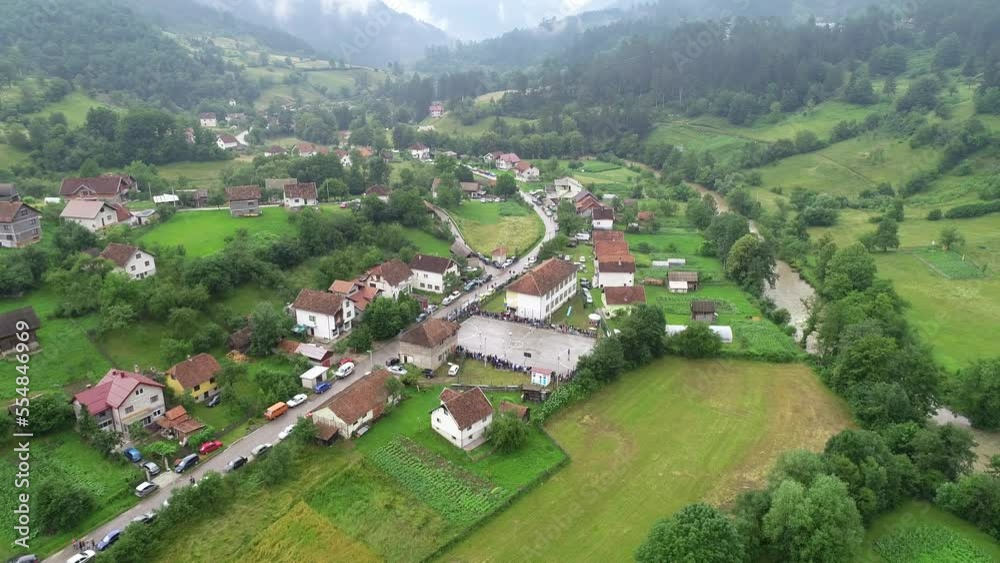 top view drone flying above amateur soccer game match. Countryside authentic tournament. 