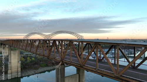 Mud Island State Park in Memphis Tennessee. Rising aerial reveals Hernando de Soto bridge over Mississippi River at sunrise. photo