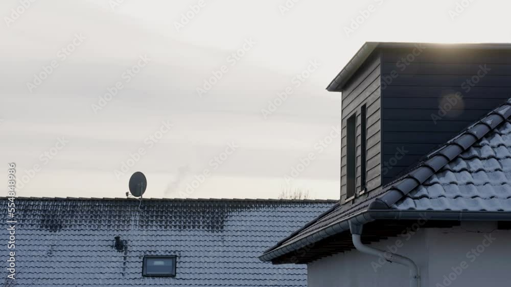 Beautiful Cinematic Establishing Shot of Snow Covered Roof in the Sunshine