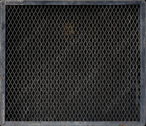 Dirty black metal mesh of industrial machinery radiator texture background