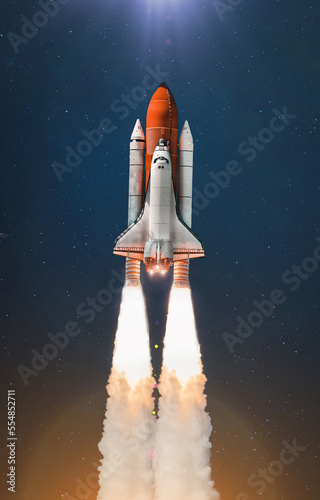 Space shuttle flight in outer space. Launch of rocket with astronauts. Mission of spaceship. Elements of this image furnished by NASA