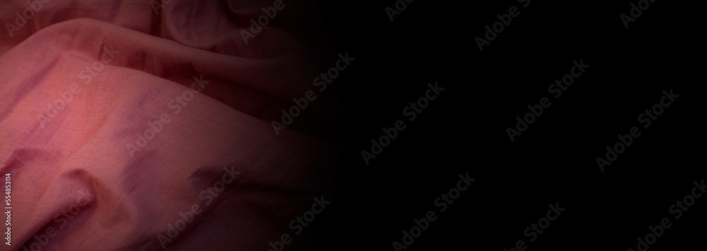 folds of purple curtains. wrinkled light fabric. pink creative background	