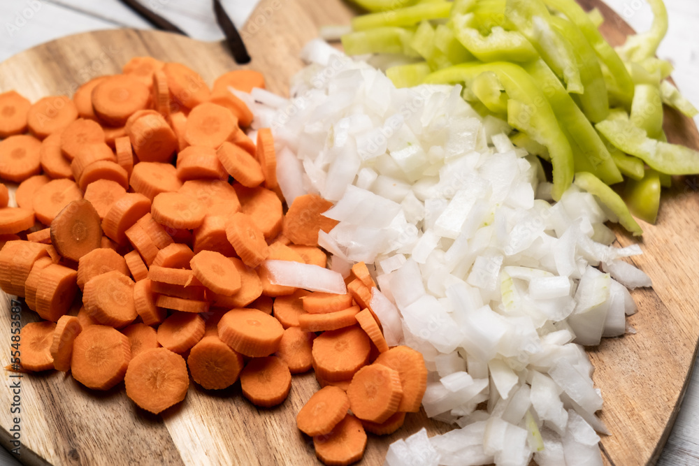 Chopped fresh peppers, onions, carrots. Vegetarianism concept. Mix of vegetables. Chopped fresh peppers, onions, carrots. Vegetarianism concept. Mix of vegetables.