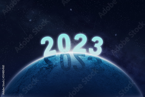 2023, the number on the planet in space. Shadow. Festive background. Christmas