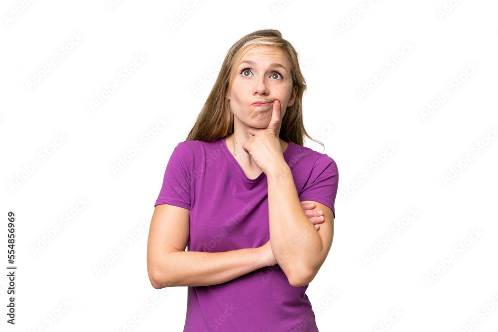 Young blonde woman over isolated background having doubts while looking up Young blonde woman over isolated background having doubts while looking up