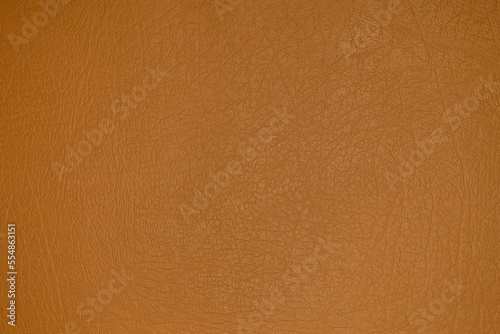 The texture and background of the leatherette is light brown. Leatherette pattern texture as background and design element. Leather background for design development