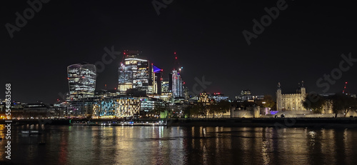 Night view of London part of the capital of Great Britain with the River Thames and the new skyscrapers of The City. © rparys