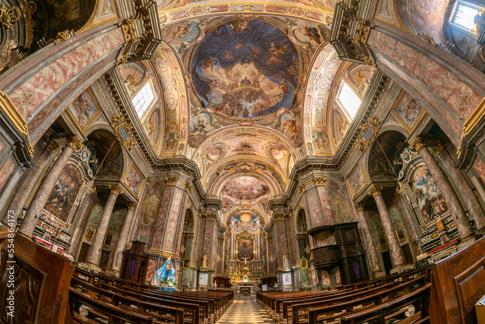 Carrù, Piedmont, Italy - May 17, 2022: internal view of the parish church of Maria Vergine Assunta (Virgin Mary of the Assumption) with frescoed vaults, fish eye view