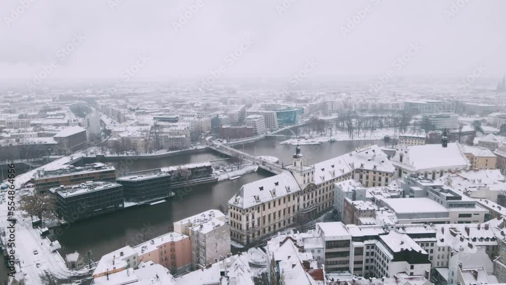 Winter aerial view with snowfall on University of Wroclaw with panoramic view in the center of city and bridges 4k Winter aerial view with snowfall on University of Wroclaw with panoramic view in the center of city and bridges 4k
