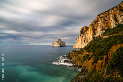 long exposure of the Porto Flavia coast in Sardinia with the Pan di Zucchero sea stack