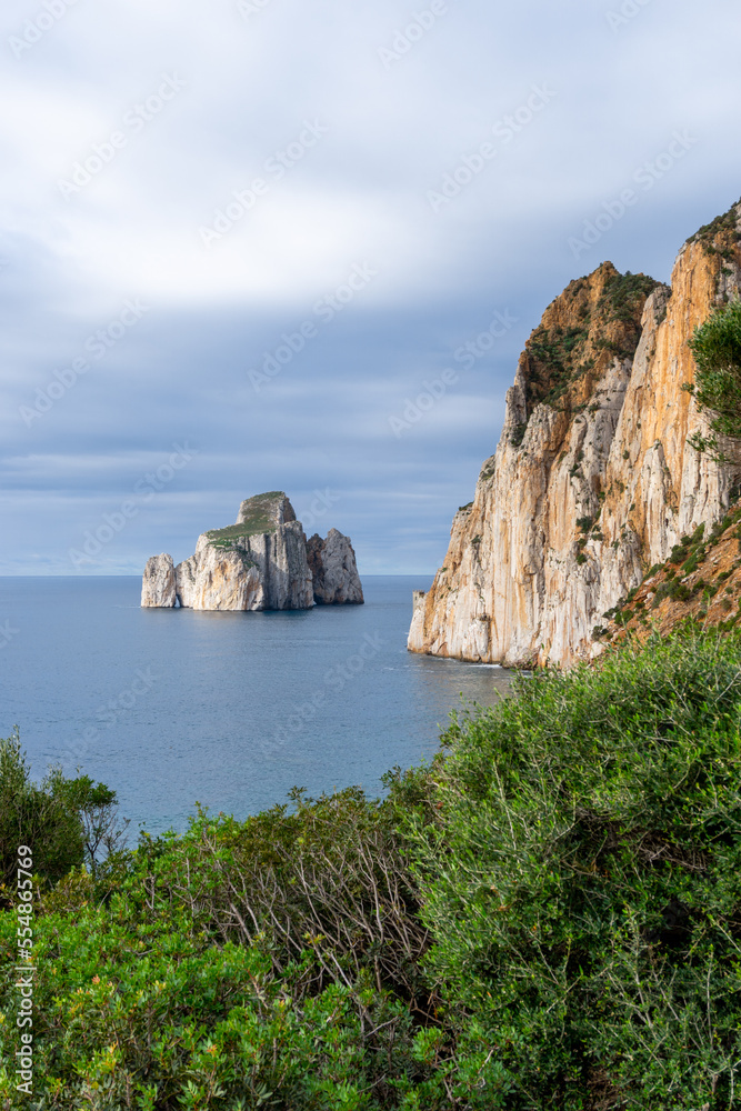 vertical landscape of the cliffs and sea stacks at Porto Flavia on Sardinia vertical landscape of the cliffs and sea stacks at Porto Flavia on Sardinia