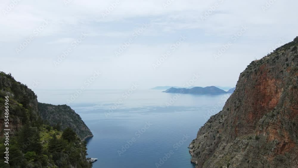 Morning aerial view from drone on Butterfly Valley and coast with boats when walking Lycian Way in Turkey 4k Morning aerial view from drone on Butterfly Valley and coast with boats when walking Lycian Way in Turkey 4k