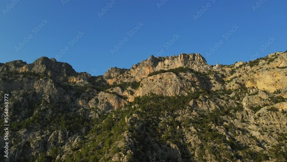 Evening aerial view from drone on mountains near village Kabak on Paradise Beach when walking Lycian Way Trail in Turkey 4k Evening aerial view from drone on mountains near village Kabak on Paradise Beach when walking Lycian Way Trail in Turkey 4k