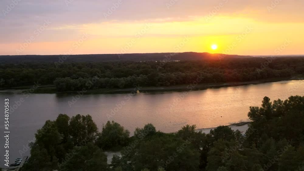 Top view of the river, bird's eye view of the green slopes of the Dnipro River in the light of the sunset Top view of the river, bird's eye view of the green slopes of the Dnipro River in the light of the sunset