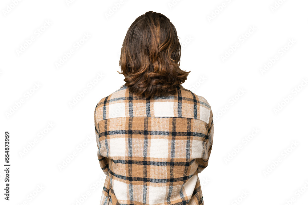 Young caucasian man isolated on green chroma background in back position Young caucasian man isolated on green chroma background in back position