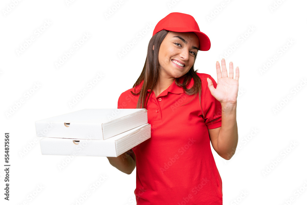 Pizza delivery caucasian woman with work uniform picking up pizza boxes isolated on green chroma background saluting with hand with happy expression Pizza delivery caucasian woman with work uniform picking up pizza boxes isolated on green chroma background saluting with hand with happy expression