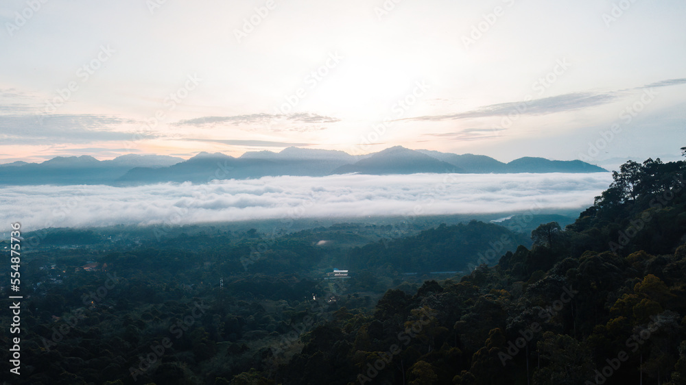 Sea clouds during golden sunrise above Titiwangsa mountains in Lenggong, Perak.