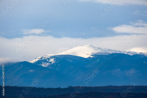 mountain pick with snow and heavy clouds in winter season, Bulgaria