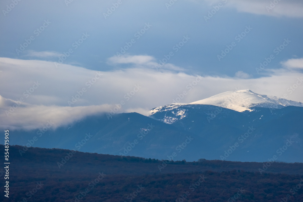 mountain pick with snow and heavy clouds in winter season, Bulgaria